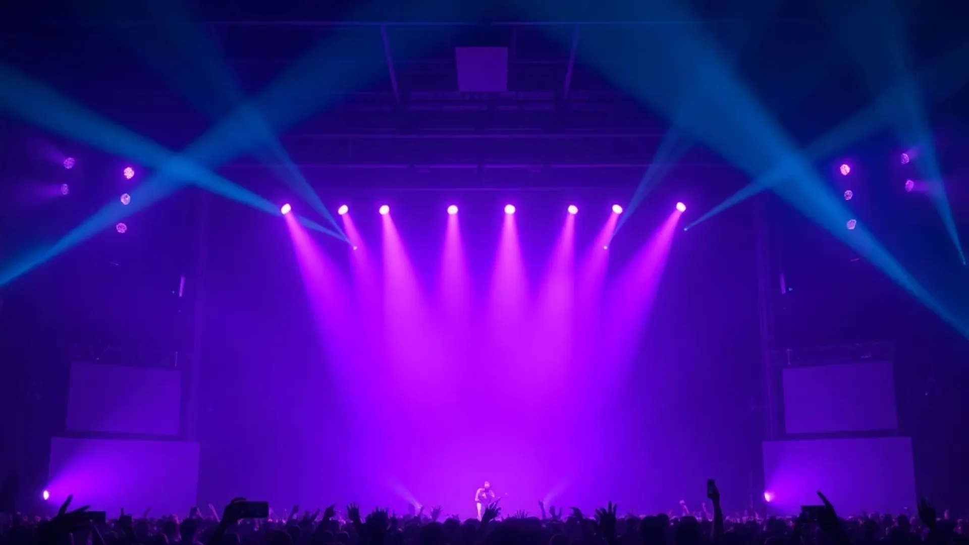 Live concert venue with dramatic stage lighting — Entertainment AI imagery by photosby.ai